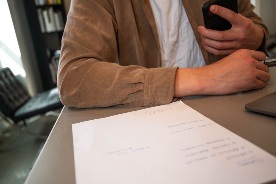 Signing documents at a table with a mobile notary in Evansville
